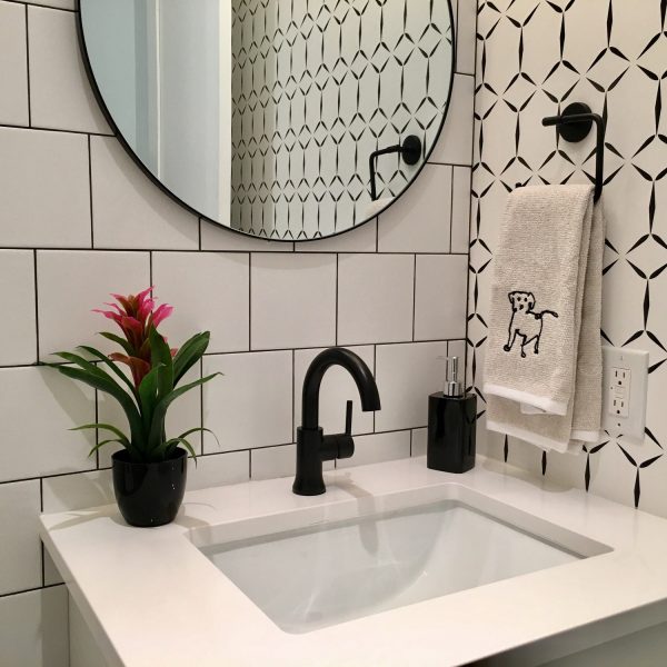Modern bathroom design in sharp black and white contrast and striking geometrical patterns